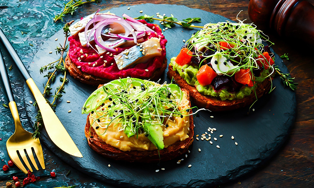 ciabatta, avocado, fish, hummus and onion microgreen